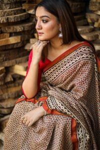women sitting wearing a chanderi silk saree