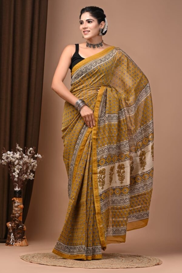 Mustard-yellow Chanderi silk saree with Bagru block print floral booti and arch border pallu
