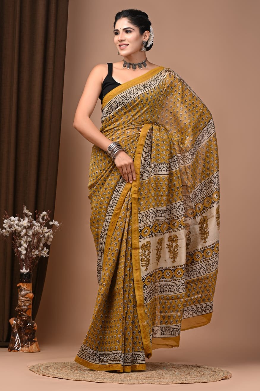 Mustard-yellow Chanderi silk saree with Bagru block print floral booti and arch border pallu