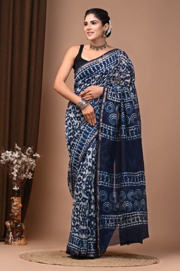 Woman draped in indigo blue Chanderi silk saree with Bagru hand block printed circle and floral motifs