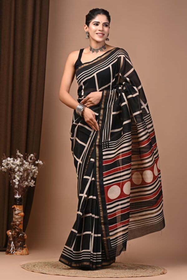 Woman wearing black Chanderi silk saree with cream geometric grid Bagru hand block print and striped maroon pallu