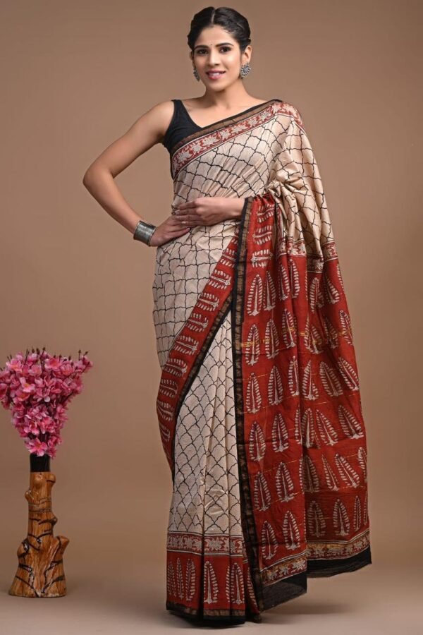 Cream Chanderi silk saree with black lattice print and rust-red Bagru leaf motif border