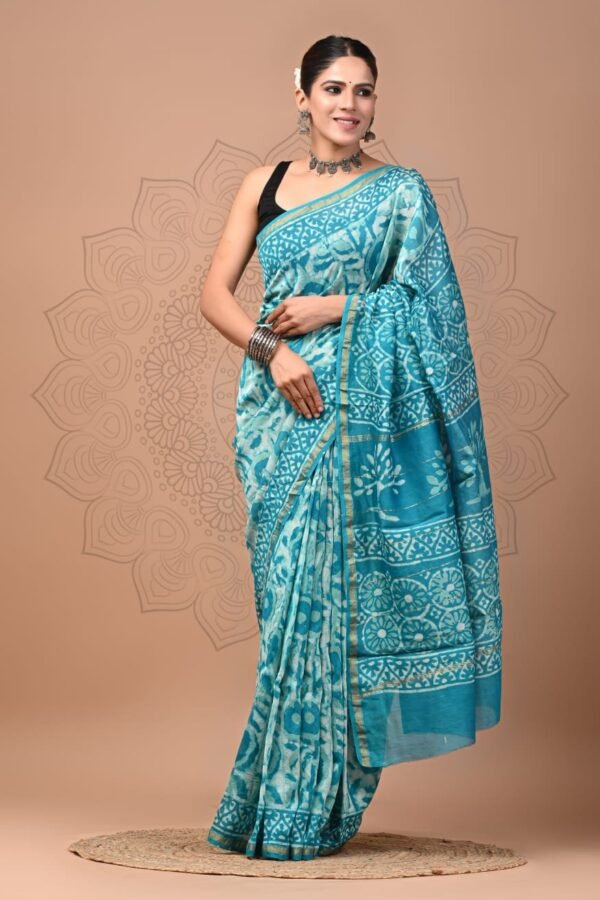 Woman draped in turquoise blue Chanderi silk saree with white Bagru floral medallion hand block print