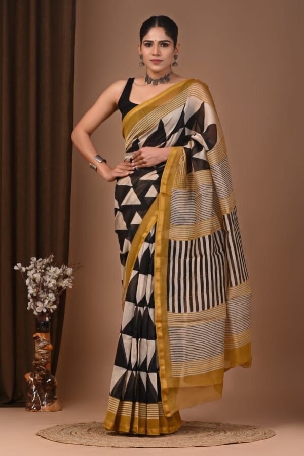 Woman wearing black and cream Chanderi silk saree with geometric triangle block print and mustard border