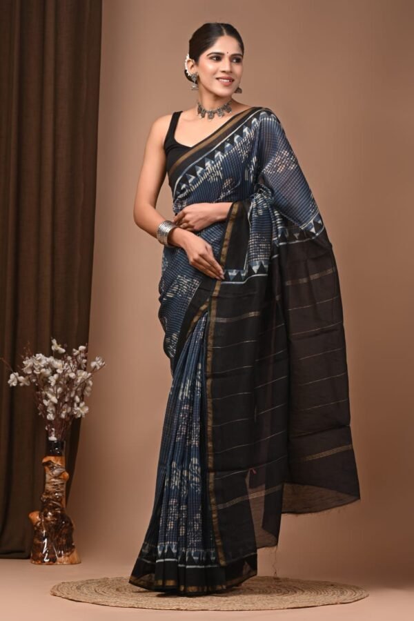 Woman wearing indigo-blue hand block printed Chanderi silk saree with black zigzag border