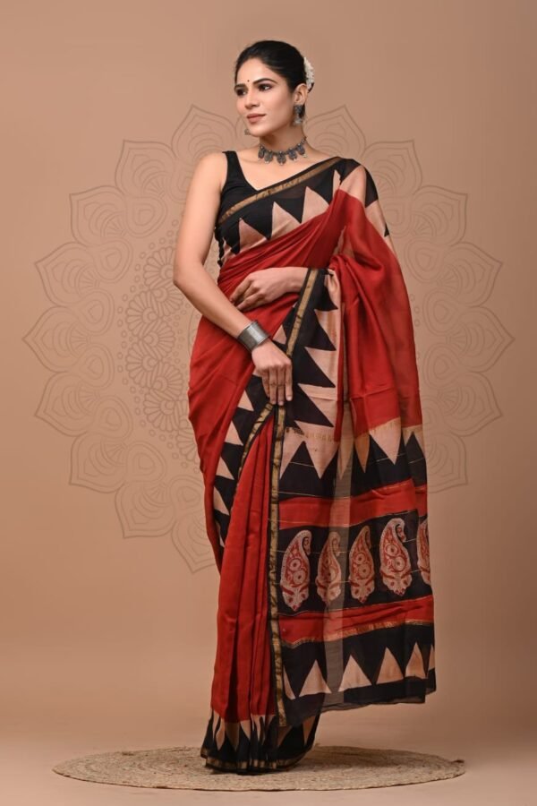 Woman wearing red Chanderi silk saree with black zigzag border and paisley pallu