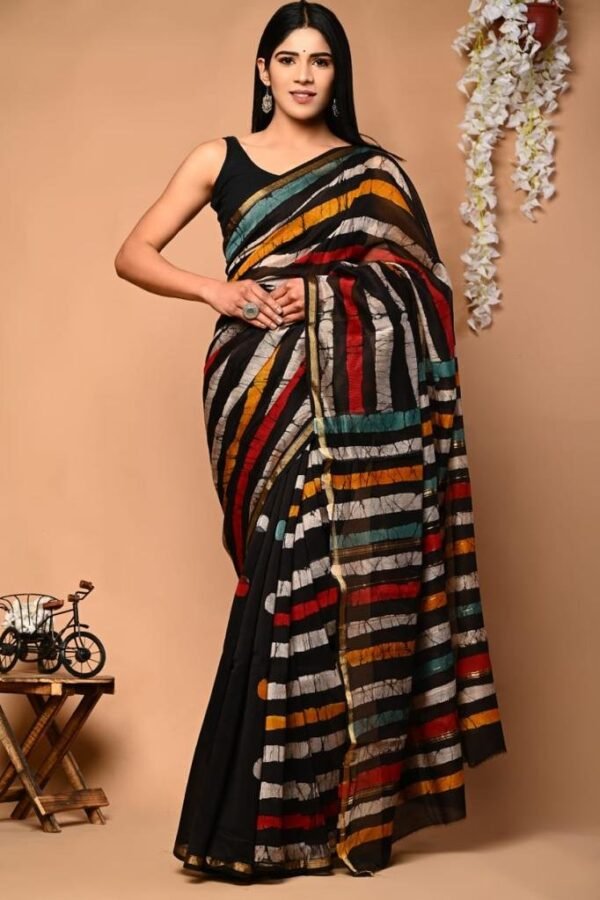 Woman wearing black Chanderi silk saree with multicolor striped hand block print and golden border
