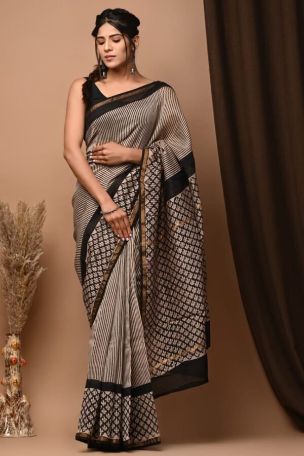 Beige Chanderi silk saree with black pinstripe print and diamond motif border, draped on model