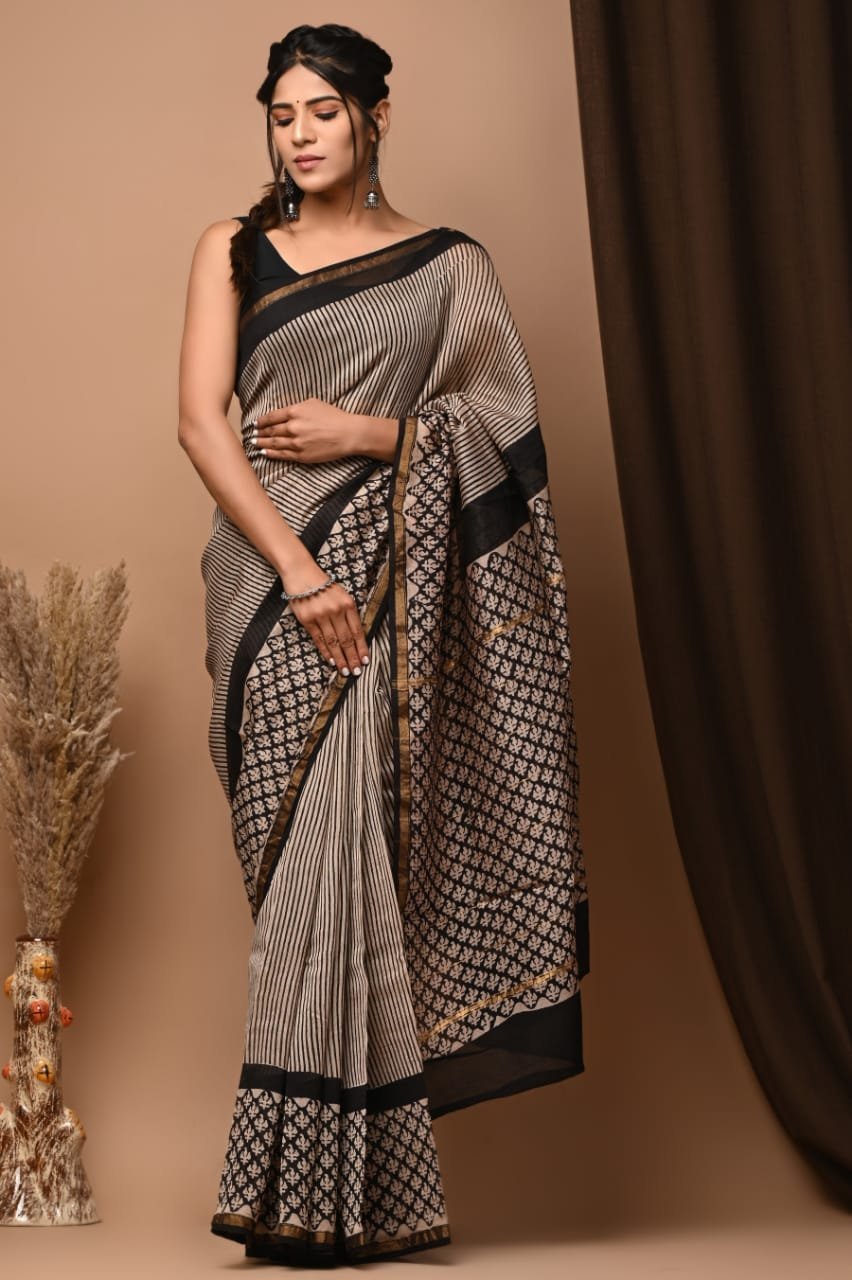 Beige Chanderi silk saree with black pinstripe print and diamond motif border, draped on model