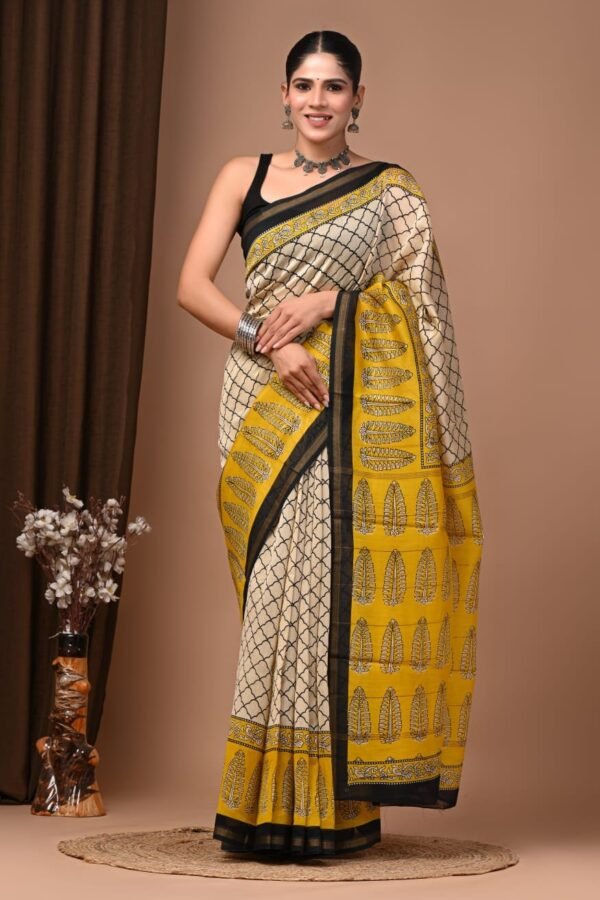 Cream Chanderi silk saree with black net print and mustard feather-motif Bagru border