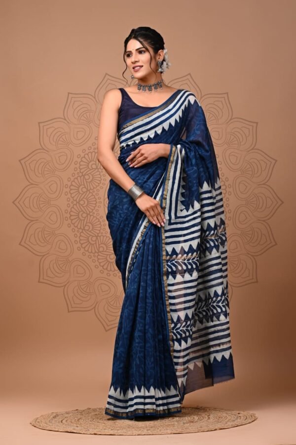 Woman wearing navy blue Chanderi silk saree with white zigzag striped border and pallu