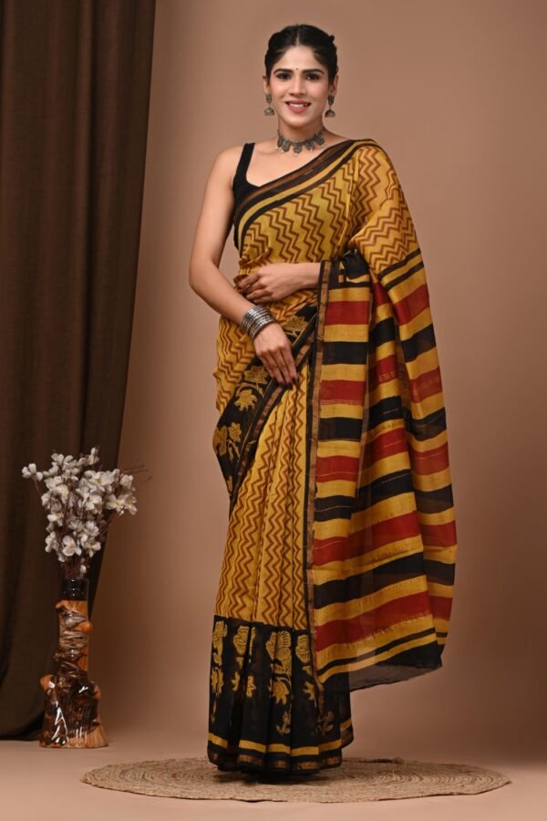 Woman wearing mustard-yellow and black zigzag print Bagru hand block Chanderi silk saree