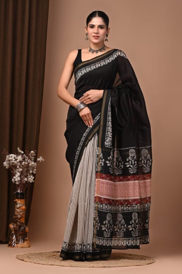 Woman in black and cream pinstripe Chanderi silk saree with floral Bagru block print pallu
