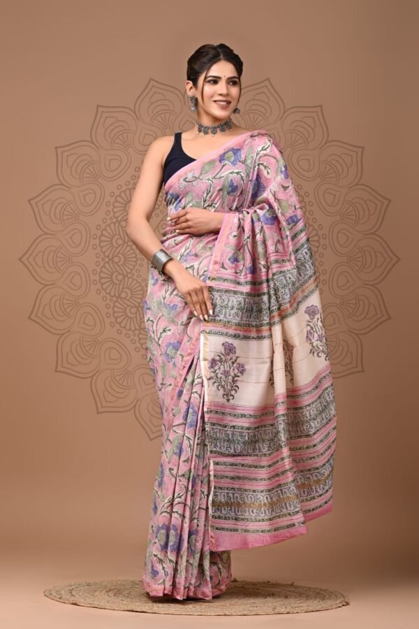 Woman draped in pink floral Chanderi silk saree with cream Bagru hand block printed border