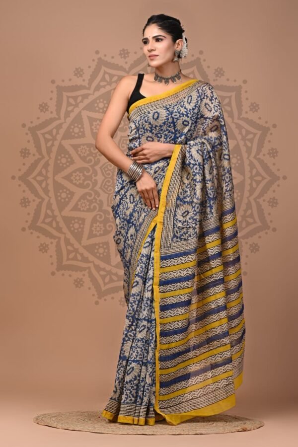 Woman draped in indigo blue Chanderi silk saree with Bagru hand block floral print and yellow border