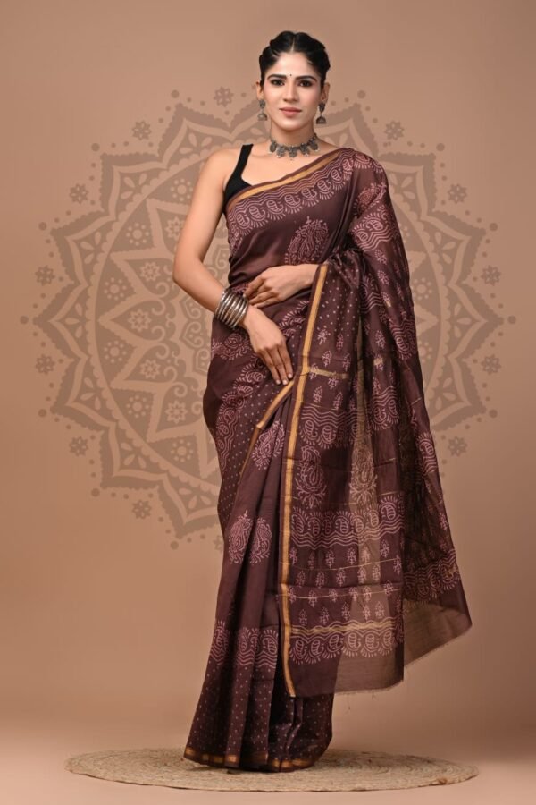Woman draped in brown Chanderi silk saree with Bagru block printed paisley motifs and gold border