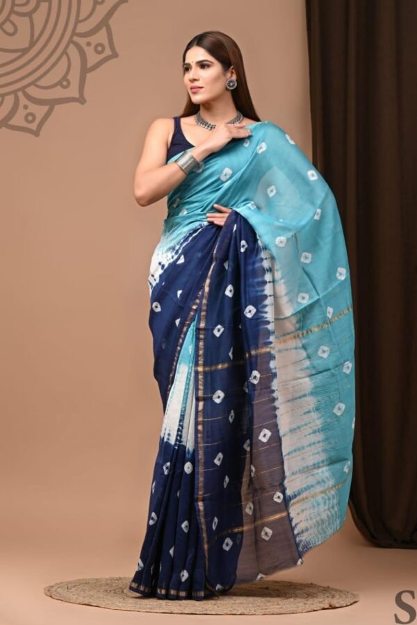 Woman draped in navy blue Chanderi silk saree with Bagru diamond print and ombre sky-blue pallu