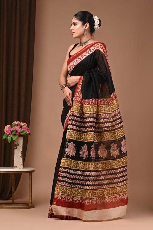 Woman wearing black Chanderi silk saree with Bagru block printed banded pallu