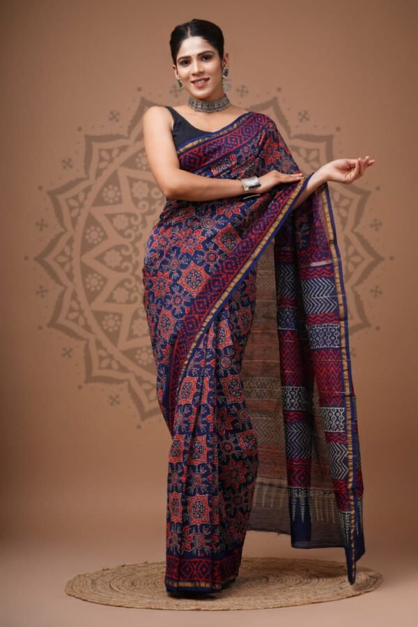 Woman wearing navy blue Chanderi silk saree with red geometric block print and chevron pallu