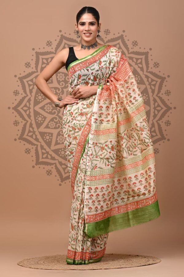 Woman wearing off-white Chanderi silk saree with coral floral bird print and green border, Bagru hand block print