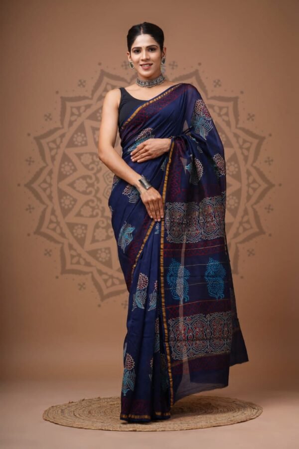 Woman in navy blue Chanderi silk saree with teal floral bird print and mustard edge, Bagru hand block print