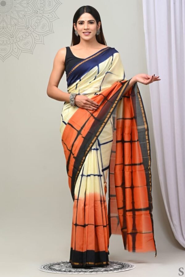 Woman in cream and orange ombre grid Chanderi silk saree with navy border, Bagru hand block print