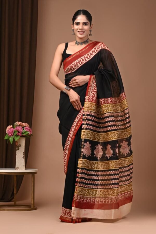 Woman wearing black Chanderi silk saree with Bagru hand block printed striped pallu