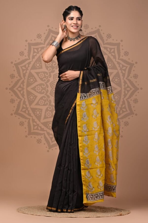 Woman draped in black Chanderi silk saree with yellow Bagru block printed paisley pallu