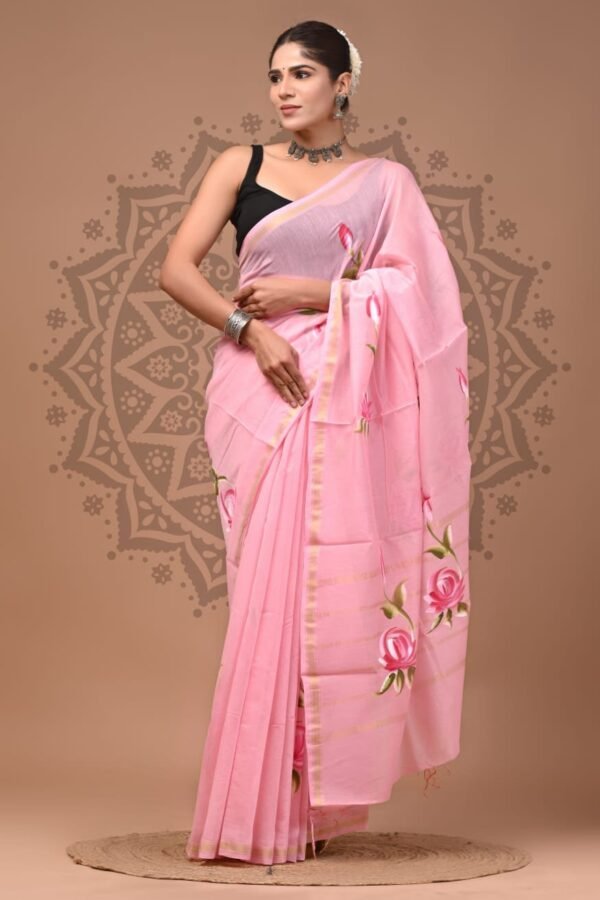 Woman draped in pink Chanderi silk saree with hand block printed rose motifs and gold border