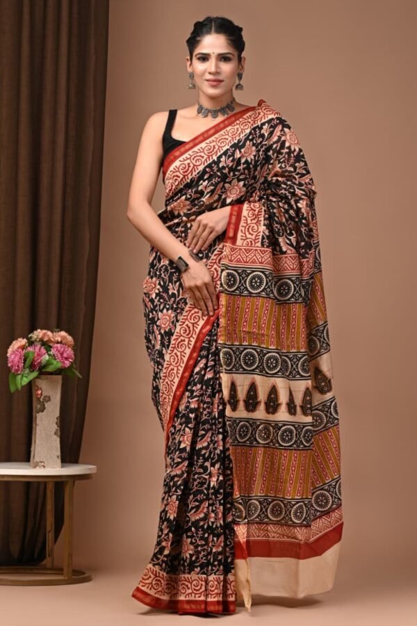 Woman draped in black Chanderi silk saree with Bagru hand block floral and medallion print pallu