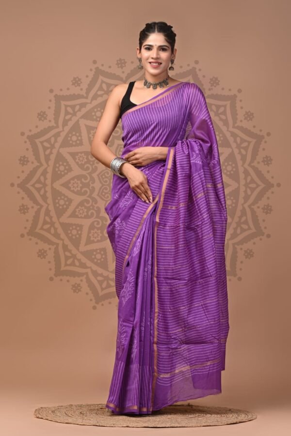 Woman draped in purple Chanderi silk saree with white pinstripe hand block print and gold border