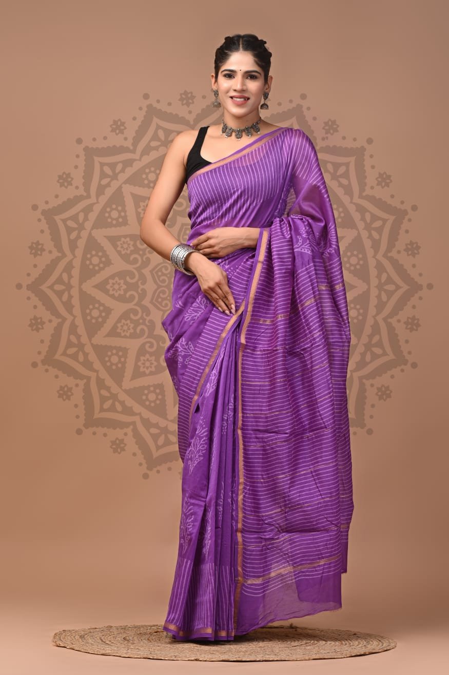 Woman draped in purple Chanderi silk saree with white pinstripe hand block print and gold border