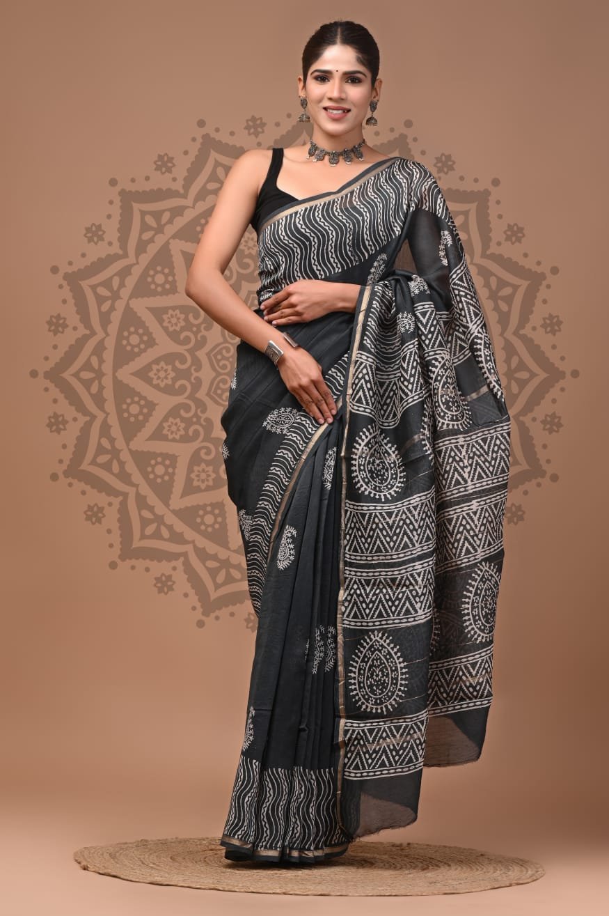 Woman in black Chanderi silk saree with white Bagru hand block wave and paisley print