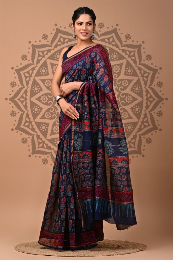 Woman draped in navy blue Chanderi silk saree with Bagru red floral and geometric hand block print