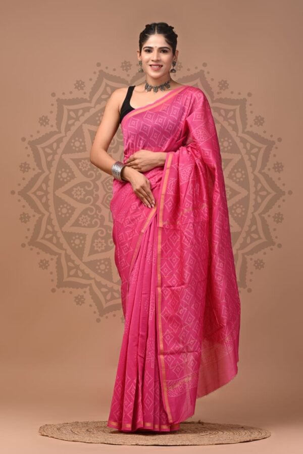 Woman wearing pink Chanderi silk saree with diamond lattice Bagru hand block print