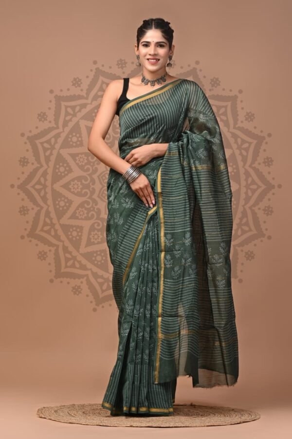 Woman draped in bottle green Chanderi silk saree with white striped Bagru hand block print and gold border
