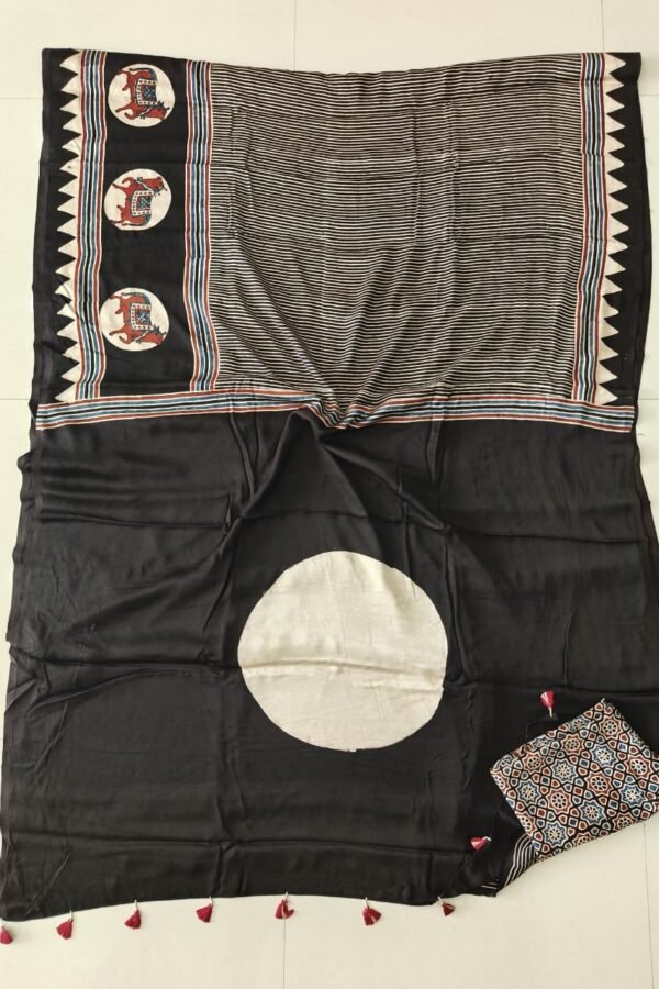 Black Ajrakh print modal silk saree with elephant motif border and striped pallu, folded flat