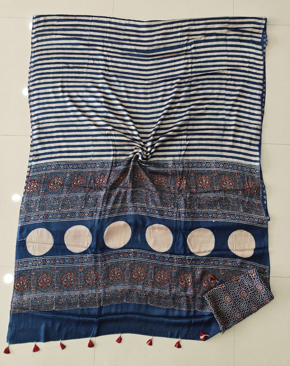 Indigo and white striped Ajrakh print modal silk saree with floral medallion border