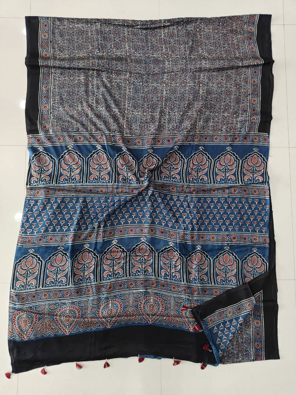 Grey-blue Ajrakh print Modal Silk saree with temple motif pallu and black border