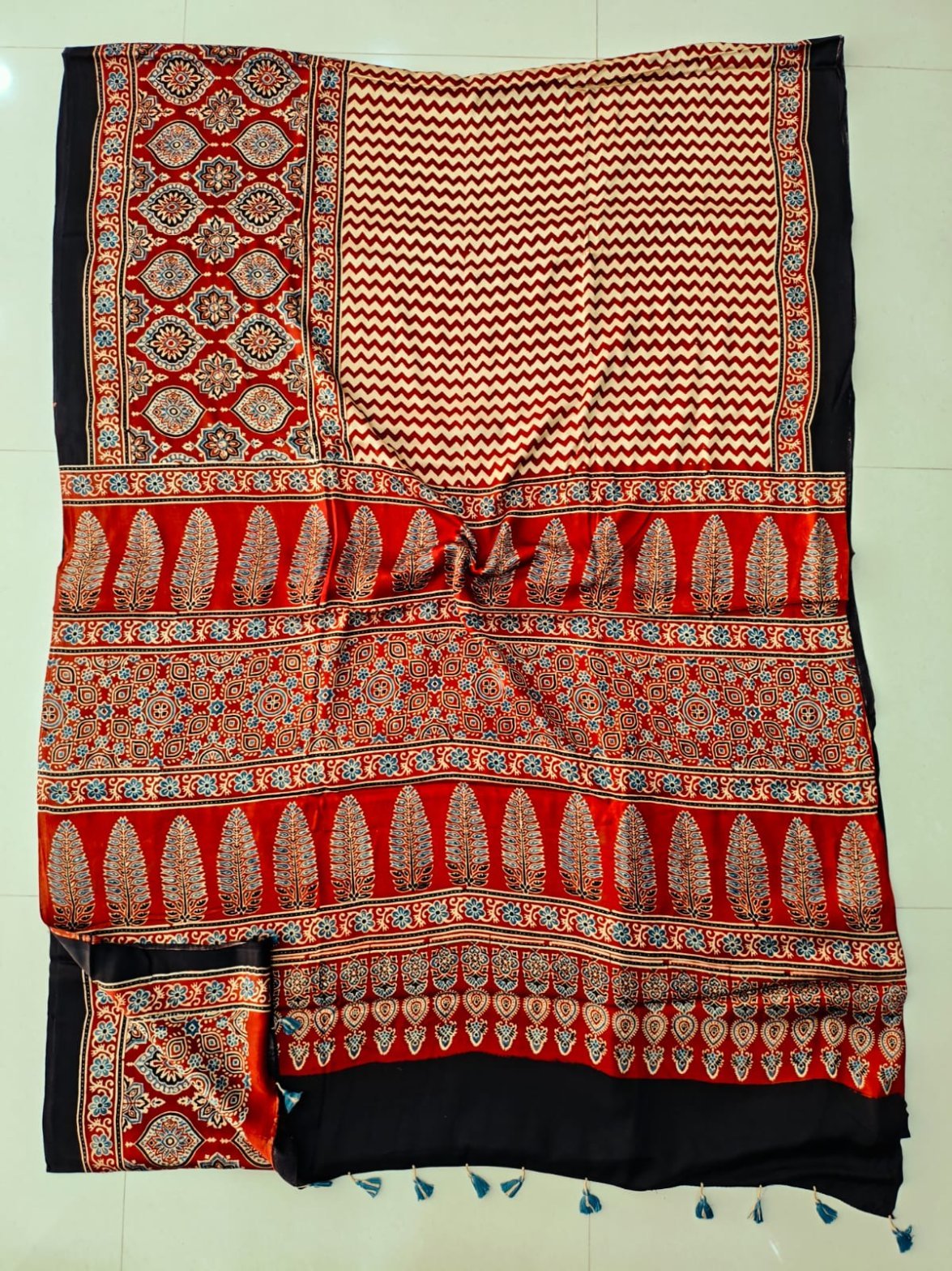 Maroon and cream chevron Ajrakh print silk saree with leaf motif pallu and black border