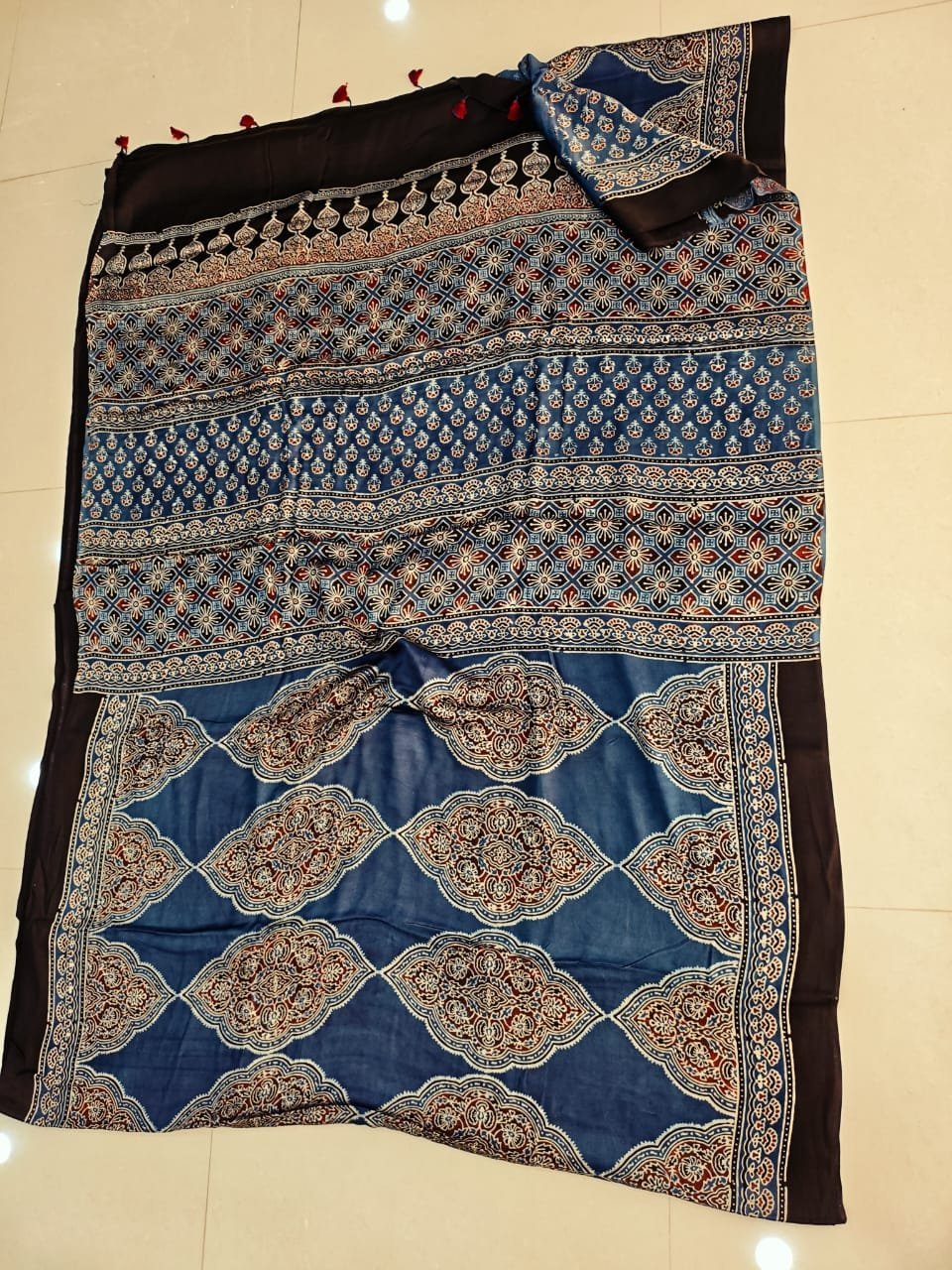Steel blue Ajrakh print pure Modal silk saree with ogee medallion pallu and black border