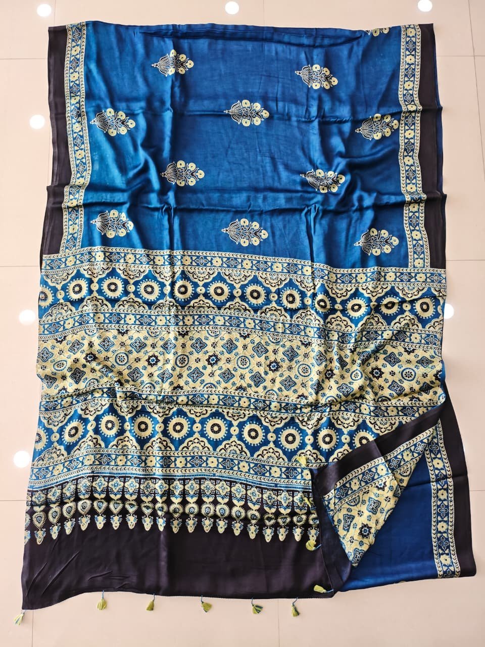 Peacock blue Ajrakh print pure Modal silk saree with cream medallion pallu and navy border