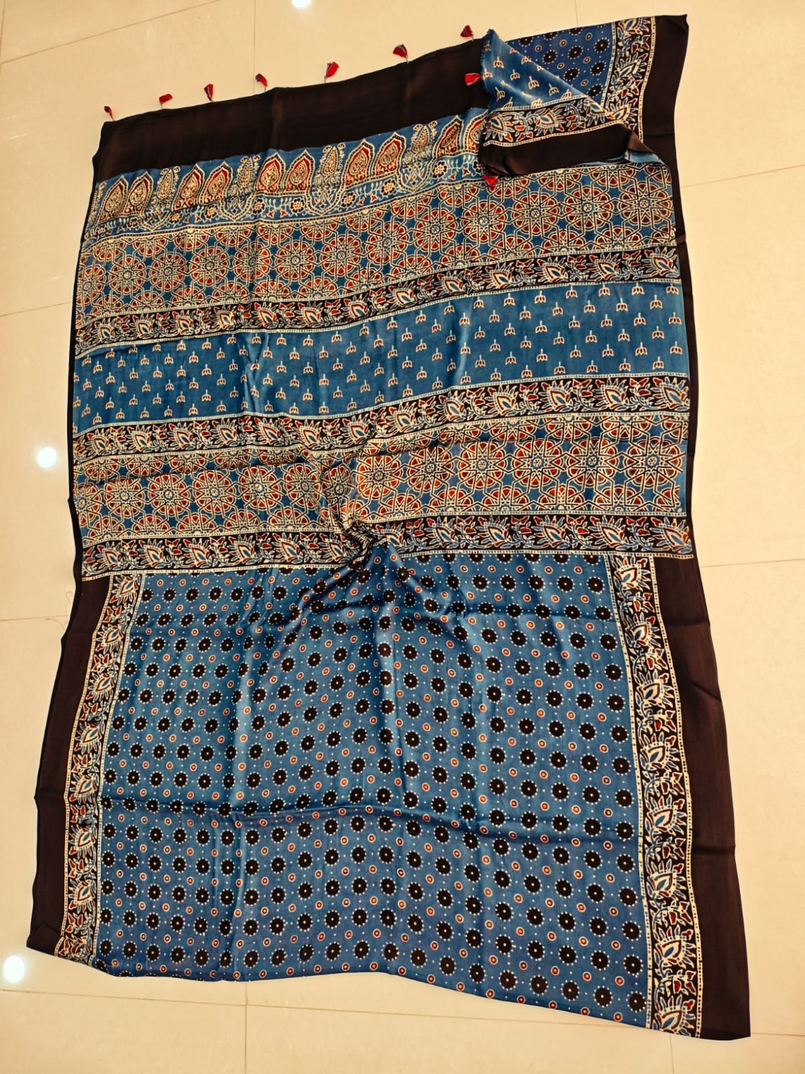 Steel blue Ajrakh print pure Modal silk saree with star-flower lattice pallu and black border