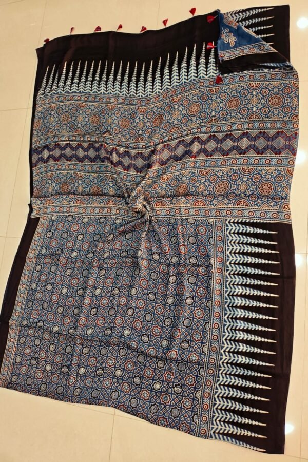 Steel blue Ajrakh print silk saree with star-flower lattice body and black leaf-motif border