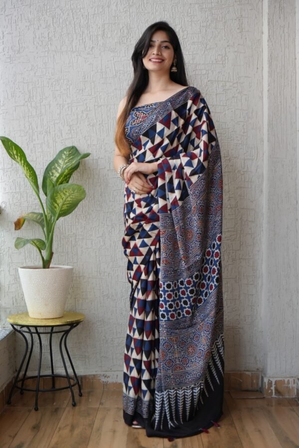 Woman wearing indigo and maroon Ajrakh print Modal Silk saree with geometric triangle pattern and floral pallu