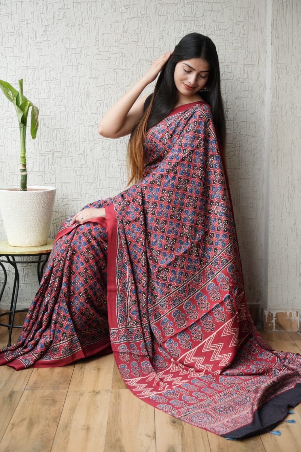 Maroon Ajrakh print Modal Silk saree with blue floral lattice and chevron border