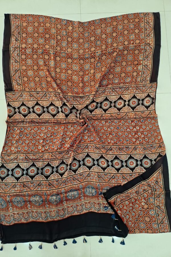 Rust orange Ajrakh print pure Modal silk saree with black border and blue tassels