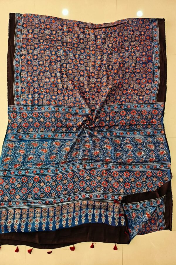 Indigo blue Ajrakh print pure Modal silk saree with paisley border and maroon tassels