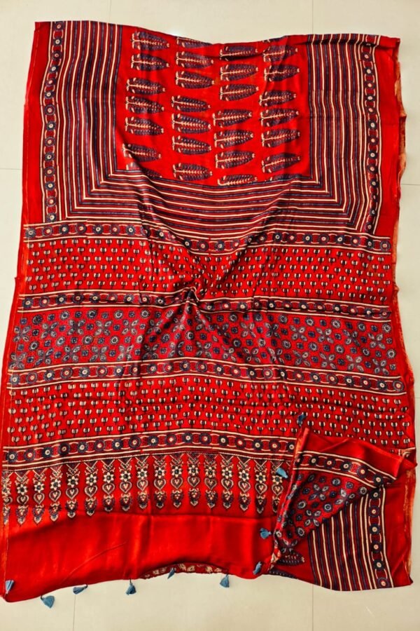 Red Ajrakh print pure modal silk saree with navy floral motifs and blue tassels