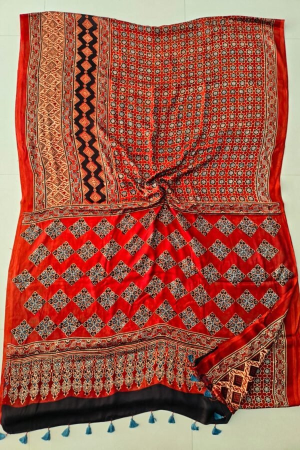 Red Ajrakh print pure Modal silk saree with diamond lattice motif and blue tassels